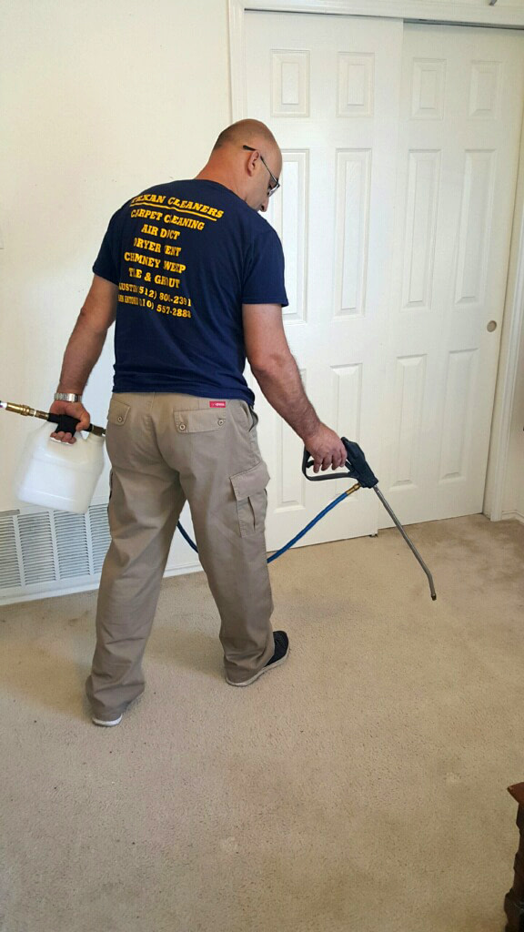 Spraying the Main Room for Carpet Cleaning